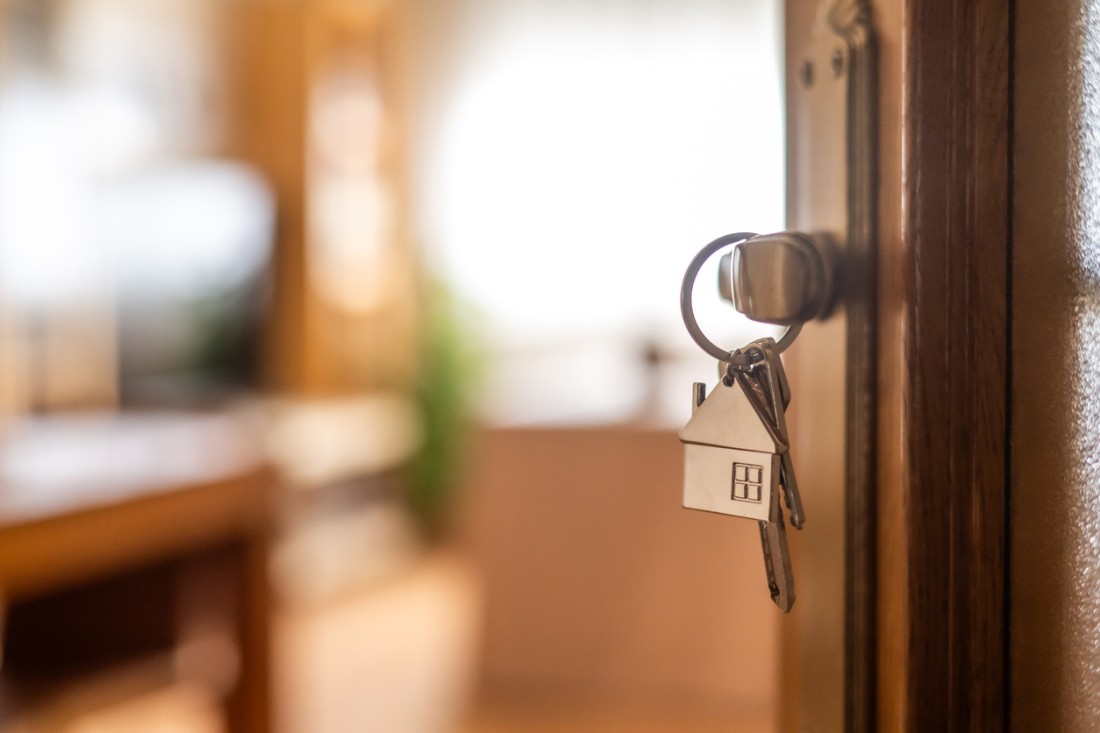The keys are hanging from the door in a new manufactured home.