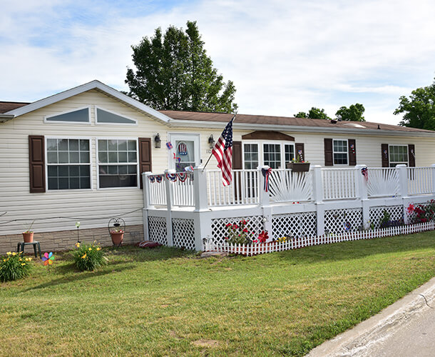 a manufactured home with a nice front porch on a community lot - Find mobile homes for sale in Delaware